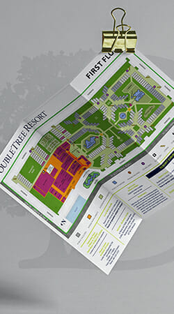 Trifold color brochure for Doubletree Resort hanging from a large paper clip.