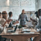 Group of 6 people in a board room.