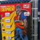 Construction safety signage attached to a chainlink fence.