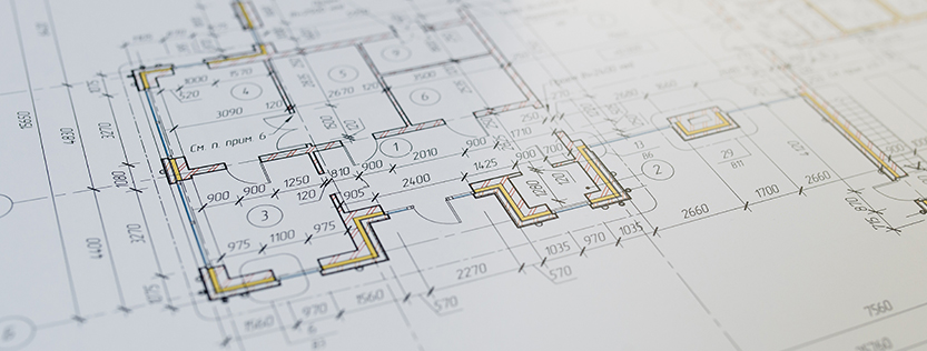 A close-up of printed blueprints on bond paper.