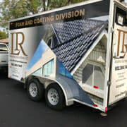 Colorful vehicle wrap on a cargo trailer