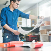 Man looking over a printed chart