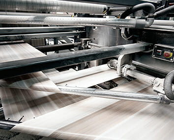 Image of large commercial printer in operation