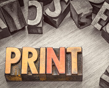 Stylized graphic showing the word PRINT using printer blocks.