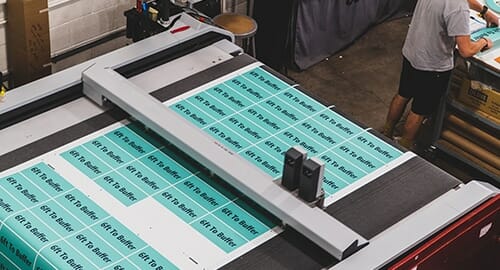 Precision cutting a new print project at PRI Graphics