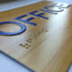 Printed braille office signage