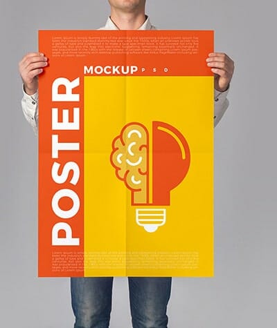 Man holding a color canvas printing that says "Poster Mockup"