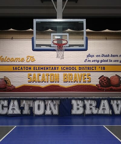Installation of interior signage and gymnasium wall mural for Sacaton Braves