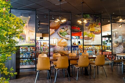 Installation of printed interior signage for Lee's Sandwiches