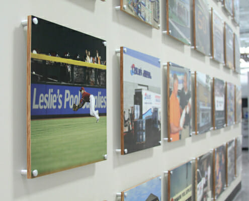 Printed MDO signage standoffs mounted on a wall