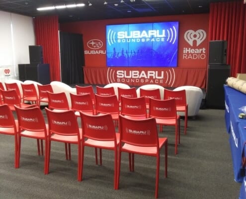 Subaru Soundspace convention with graphics printed on chairs and stage backdrop