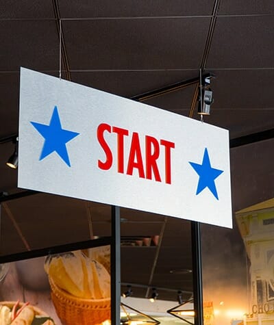 Color printed way-finding sign with the word "Start"