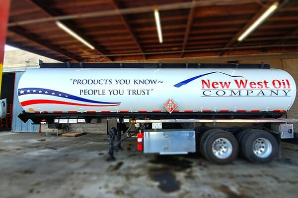 Example of wide format vehicle wrap printing on side of New West Oil container