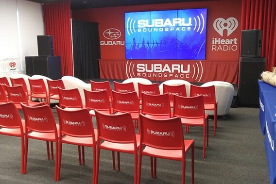 Printed presentation display graphics on chairs and convention stage for Subaru Soundspace