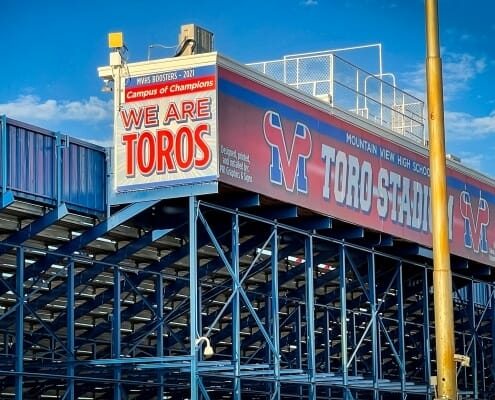 Large signage on stadium box at a high school