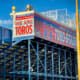 Large signage on stadium box at a high school