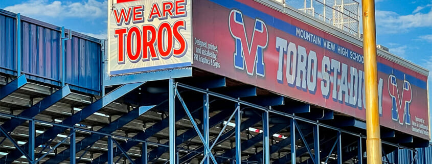 Large signage on stadium box at a high school