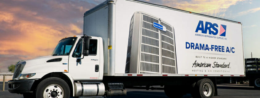 A large white delivery truck displaying vehicle wrap graphics.