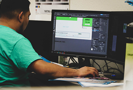 graphic designer working in adobe illustrator on print proofs careers in commercial printing