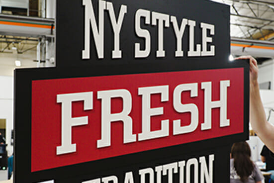 Printed Advertising signage that says NY Style Fresh.
