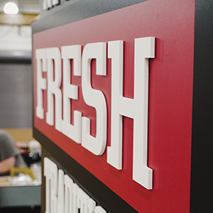 printed acrylic dimensional sign saying fresh for chompies bagels