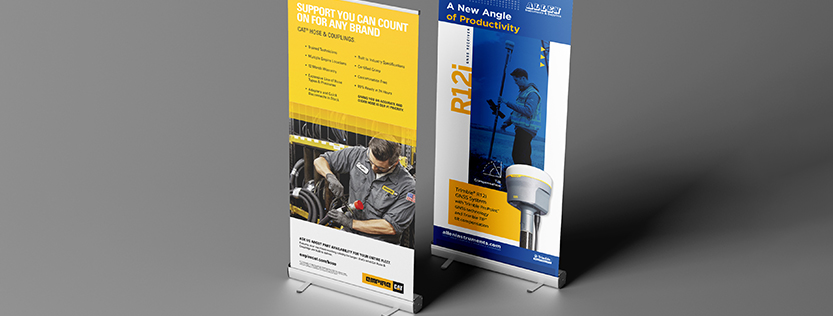 Two retractable banners for Empire CAT showcased on a grey background.