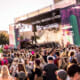Photo of an event with a large crowd near a stage.