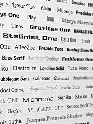 A wall with different words written in many different font types.
