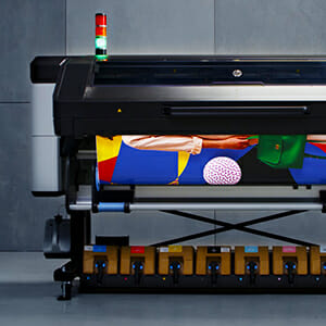 Large format color printer printing a project.