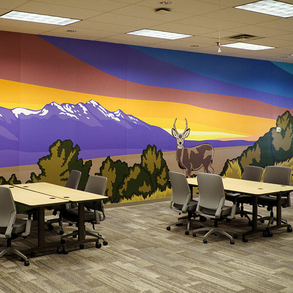 Full-size wall covering artwork depicting a deer with mountains and colorful sky in the background.