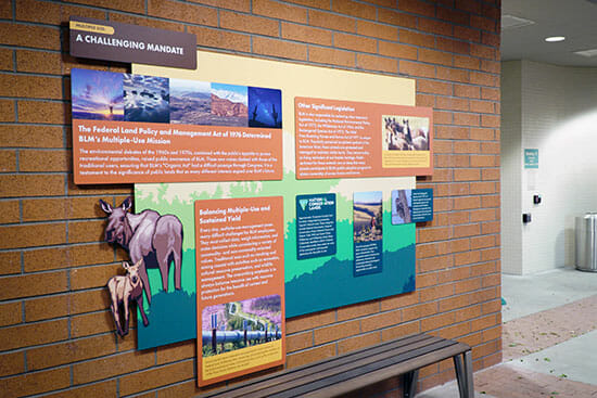 PRI_Case-Study-USBLM-ACM-Layered-Signage Interior printed wall graphics on a brick wall.