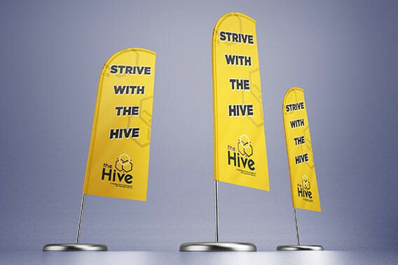 Three feather flags with text saying "Strive with the Hive" printed in school colors.