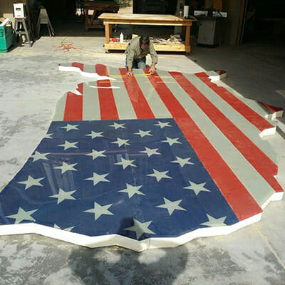American flag printed and cut to the shape of the USA.