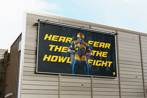 Billboard for football with the caption "Hear the howl, fear the fight."